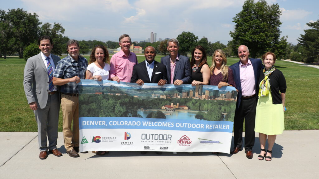 A group of attendees at the announcement event in City Park, including Michael Hancock, John Hickenlooper and Donna Lynne.