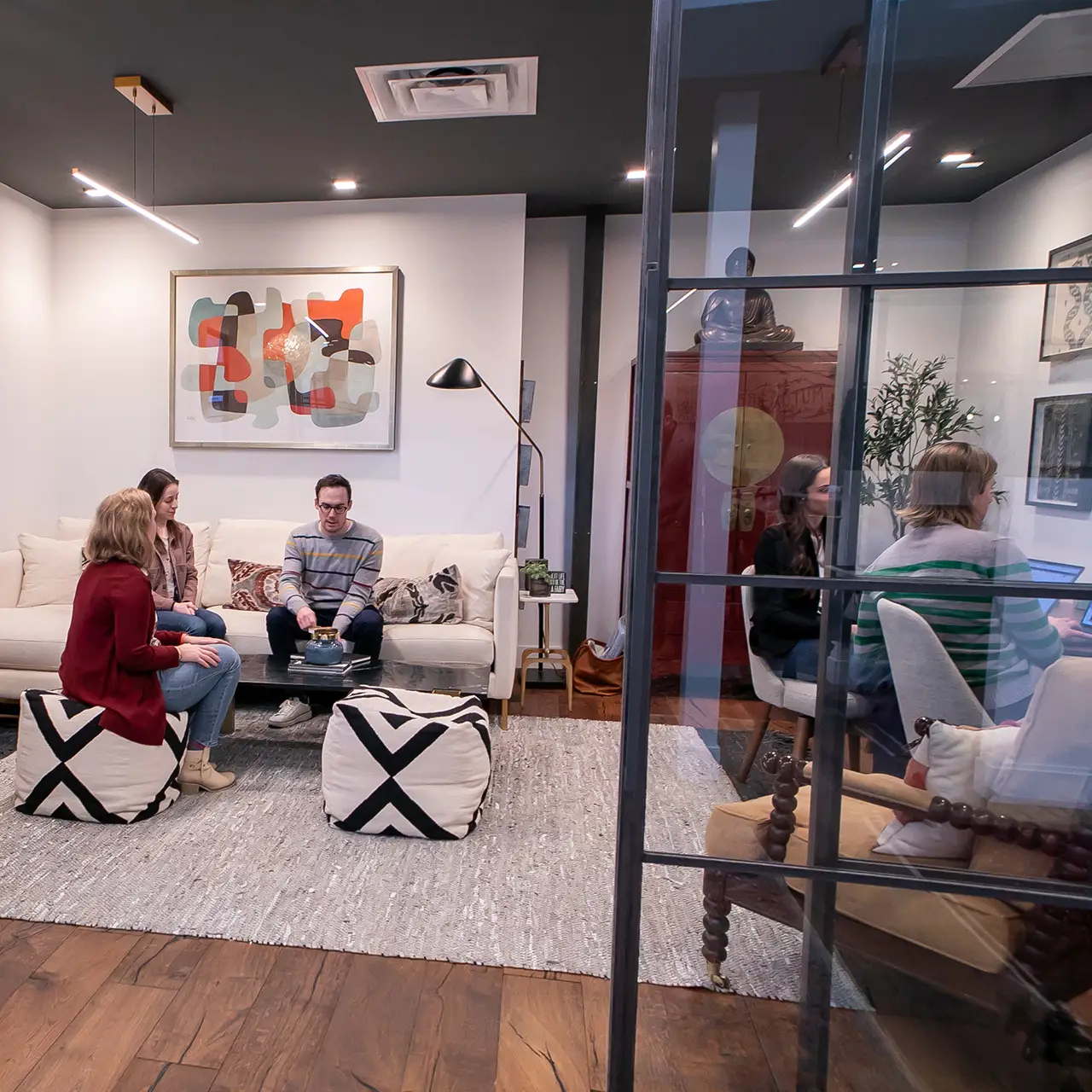 GroundFloor Media team members work in the office's Leadership Lounge.