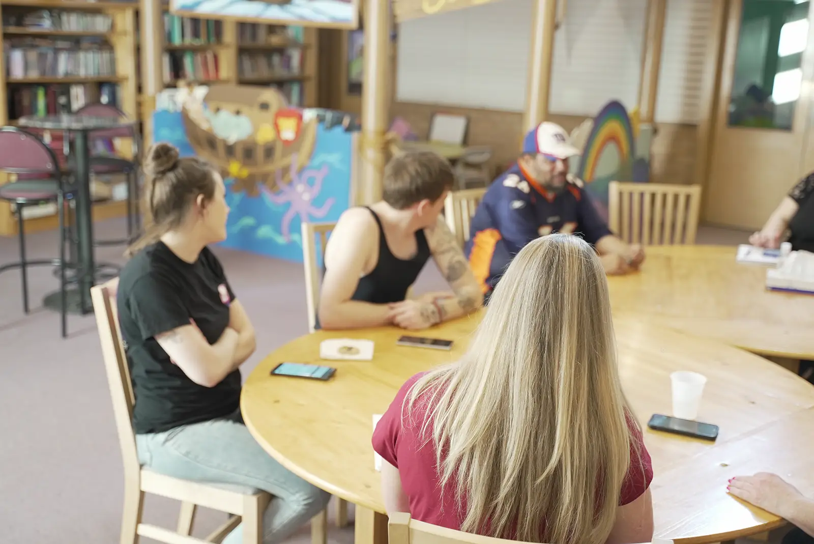 A group of parents sits together at a Circle of Parents meeting