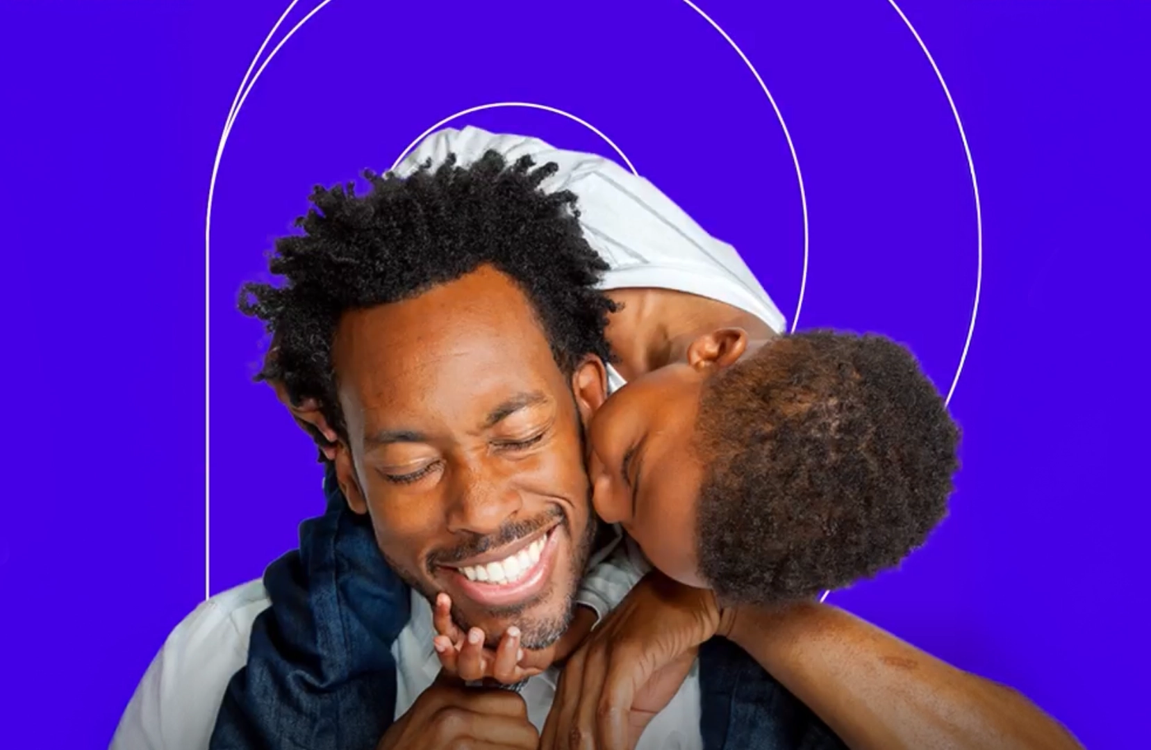 A dad and son with an Intermountain Health color and pattern behind them